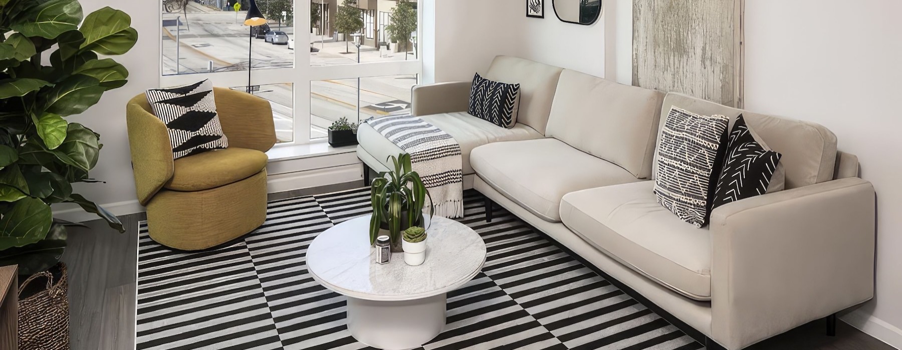 a living room with a couch, chair and coffee table