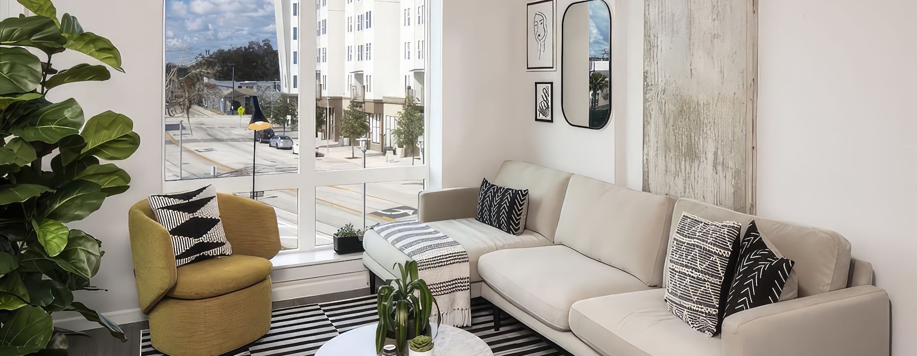a living room with a couch, chair and coffee table
