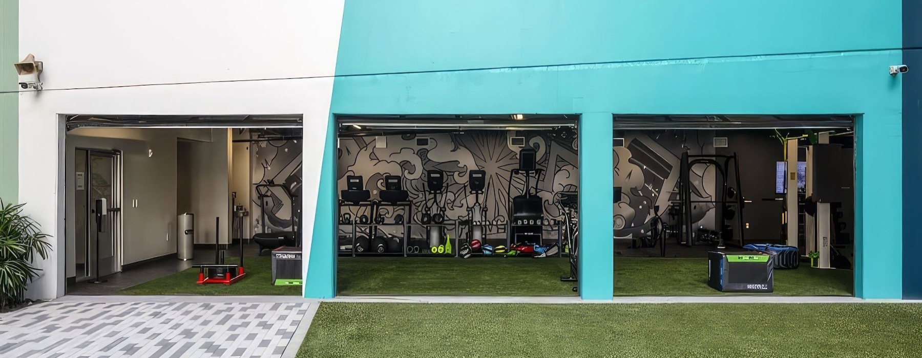 a gym with three garage openings